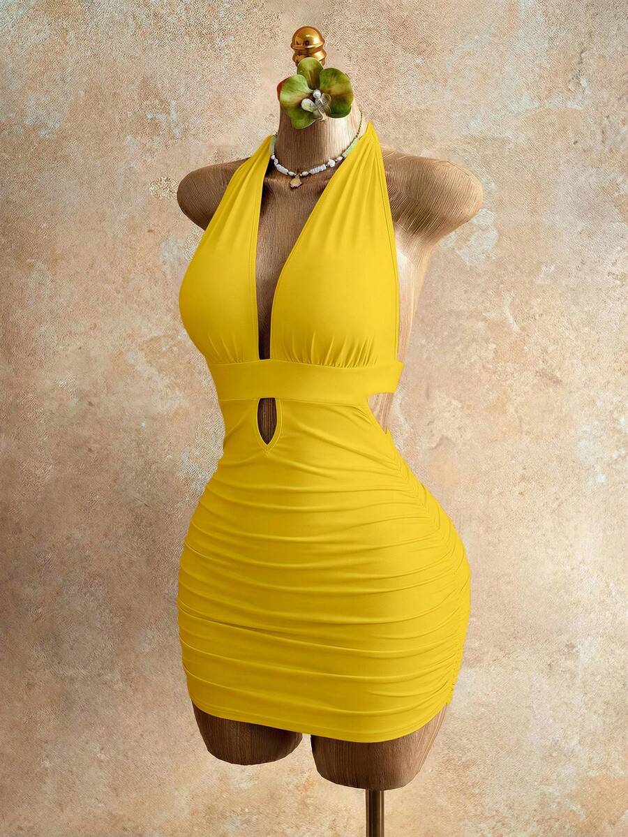 Sleeveless women's halter backless bodycon mini dress featuring lace-up knot back details and a high-waist pencil hem.