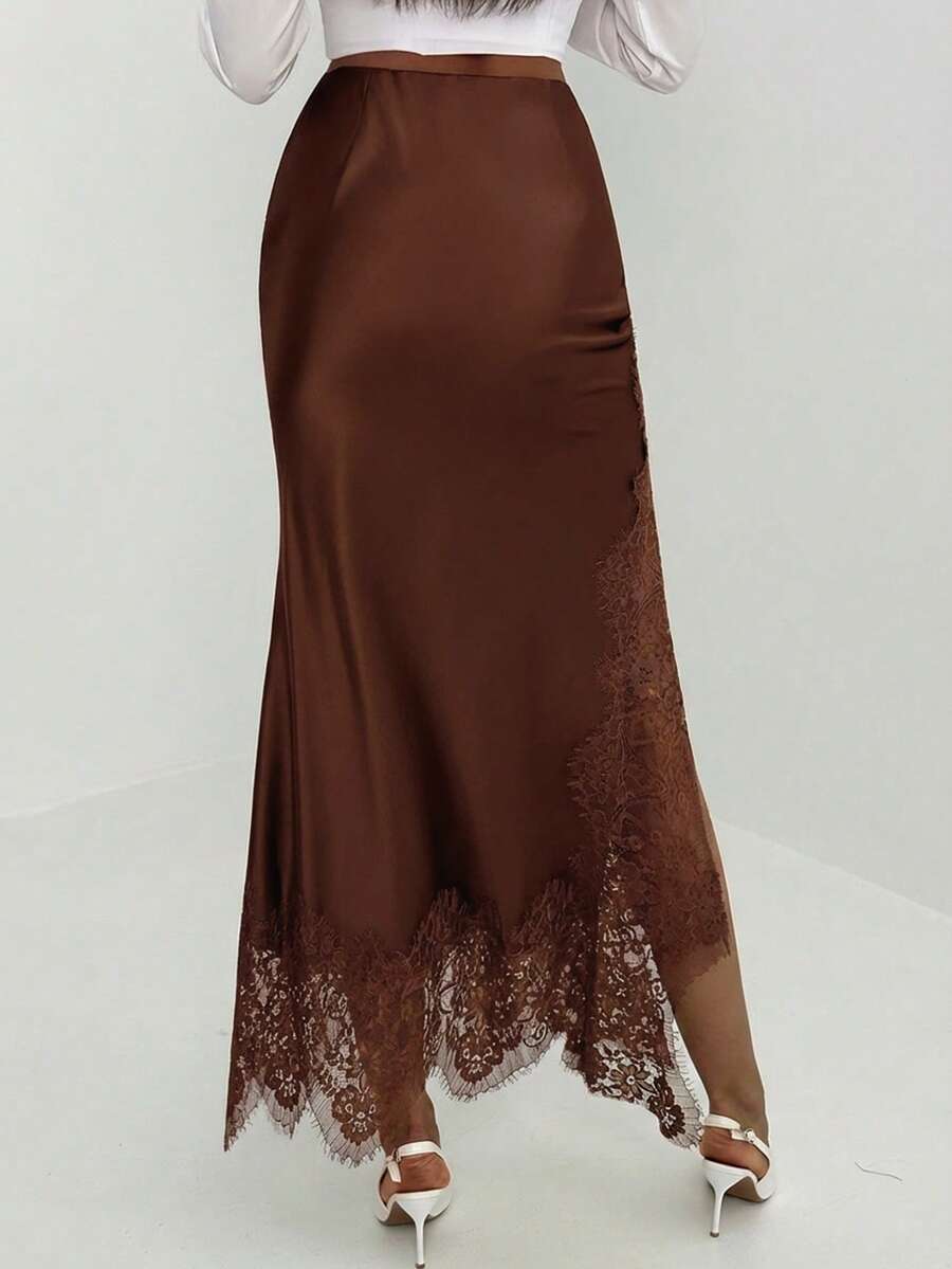 Women's elegant black lace patchwork mermaid maxi skirt featuring asymmetrical contrast lace design and low waist fit.