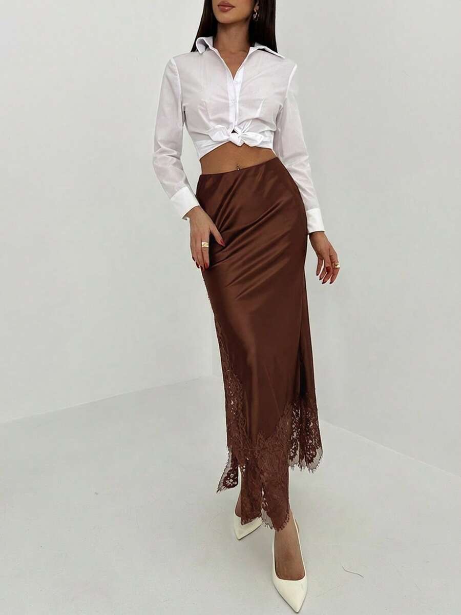Women's elegant black lace patchwork mermaid maxi skirt featuring asymmetrical contrast lace design and low waist fit.