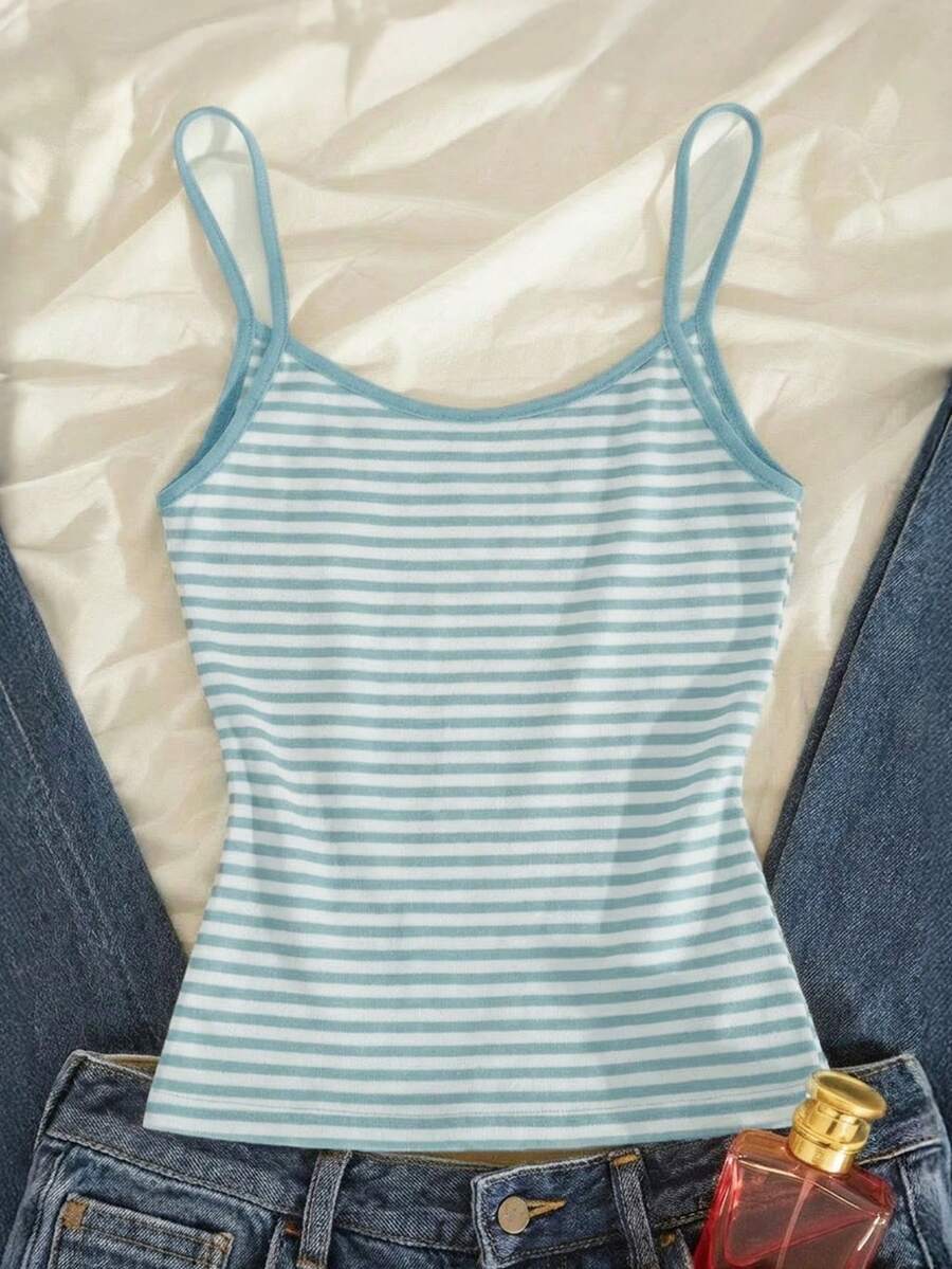 Women's pink striped crop camisole featuring criss cross spaghetti straps and slim fit design.