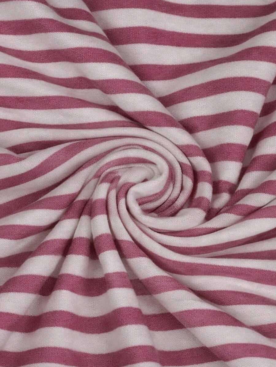 Women's pink striped crop camisole featuring criss cross spaghetti straps and slim fit design.