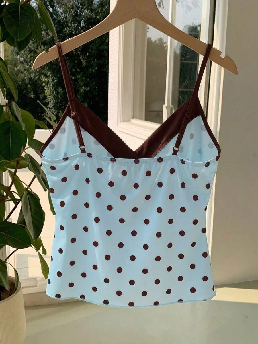 Black and white polka dot tie strap camisole top for women with thin spaghetti straps and slim fit.
