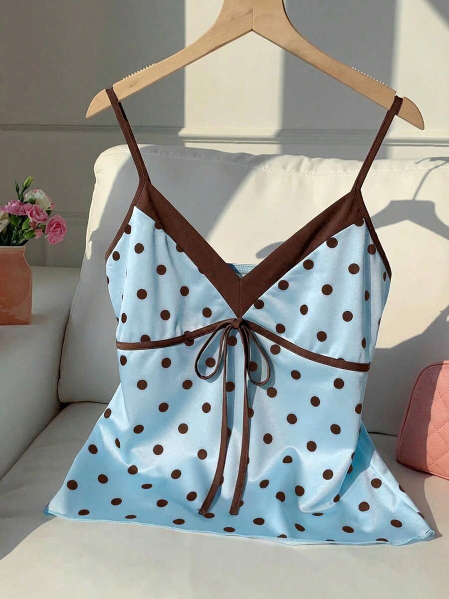 Black and white polka dot tie strap camisole top for women with thin spaghetti straps and slim fit.