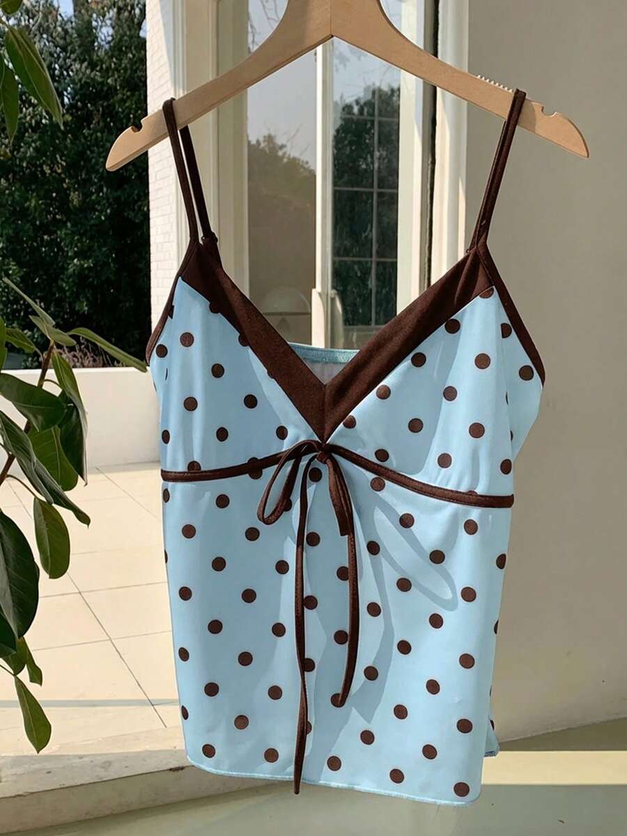 Black and white polka dot tie strap camisole top for women with thin spaghetti straps and slim fit.