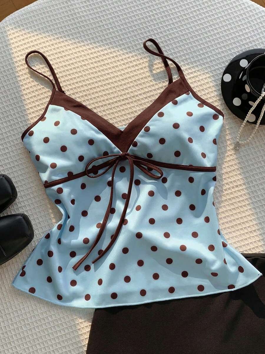 Black and white polka dot tie strap camisole top for women with thin spaghetti straps and slim fit.