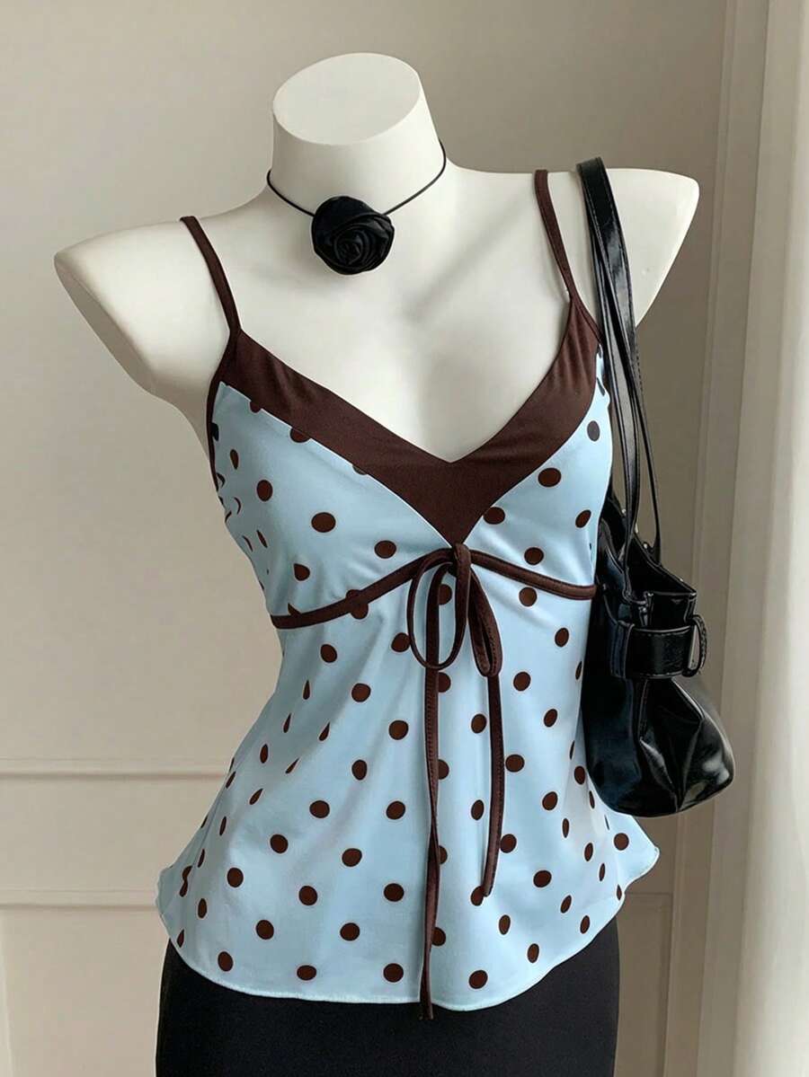 Black and white polka dot tie strap camisole top for women with thin spaghetti straps and slim fit.