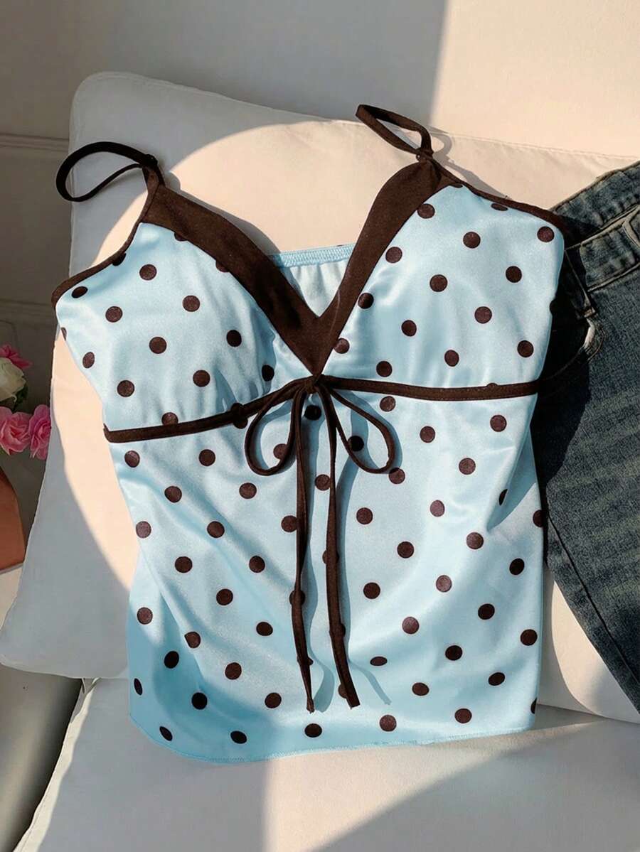 Black and white polka dot tie strap camisole top for women with thin spaghetti straps and slim fit.