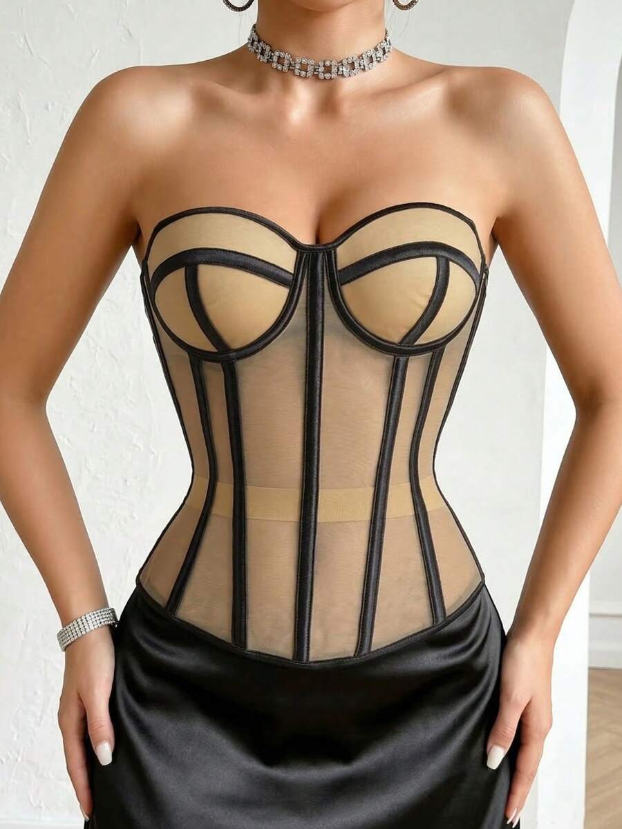 Beige strapless sheer mesh corset top for women featuring front boning, lace-up grommet eyelet detail, and push-up padded cups.