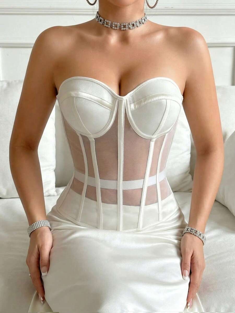 Beige strapless sheer mesh corset top for women featuring front boning, lace-up grommet eyelet detail, and push-up padded cups.