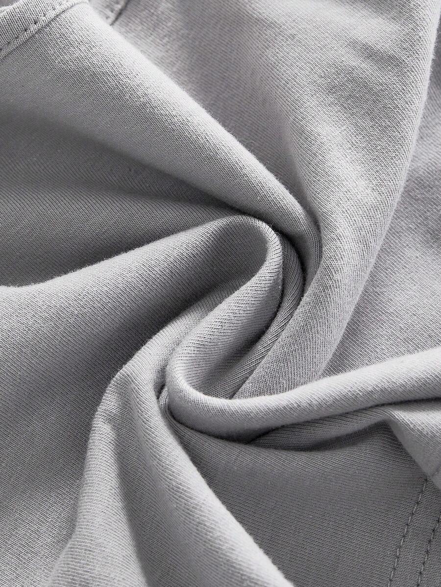 Women's light grey spaghetti strap cami top featuring a slim fit short design made from soft cotton blend knitted fabric.