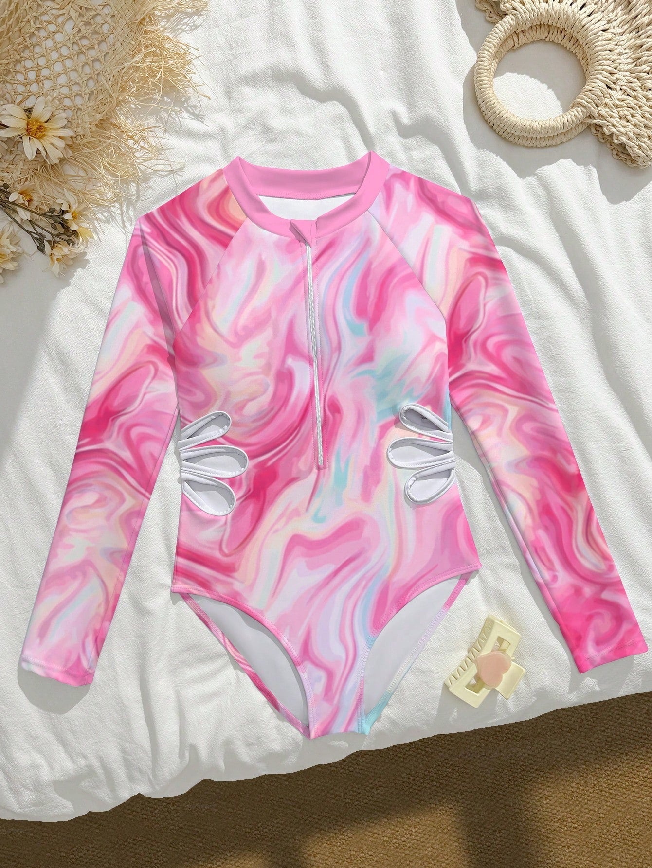 Tween girls one-piece rash guard swimsuit with long sleeves, high neck, front zipper, and ocean shell graphic print in a fitted style for beach, swimming, and vacation wear.