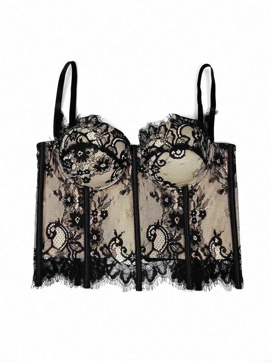 Black women's shaping cami with contrast lace, spaghetti straps, asymmetrical hem, lined body, and slim fit for casual and night-out styling.