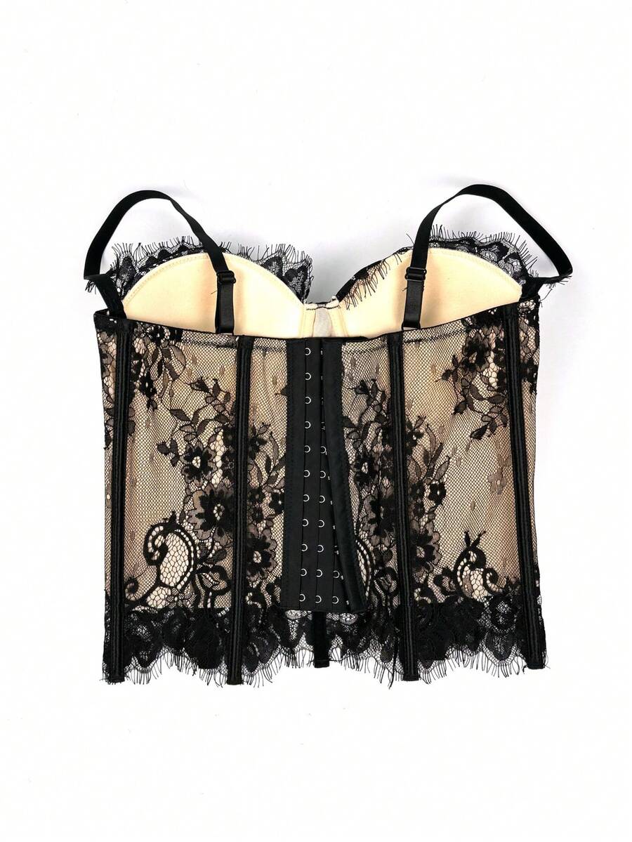 Black women's shaping cami with contrast lace, spaghetti straps, asymmetrical hem, lined body, and slim fit for casual and night-out styling.