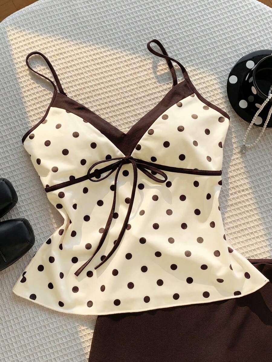 Black and white polka dot tie strap camisole top for women with thin spaghetti straps and slim fit.