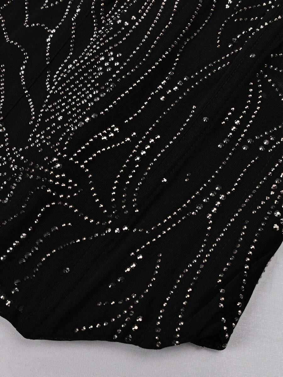 Black strapless corset tube top with sparkling rhinestone decor, boned silhouette, and lace-up tie back.