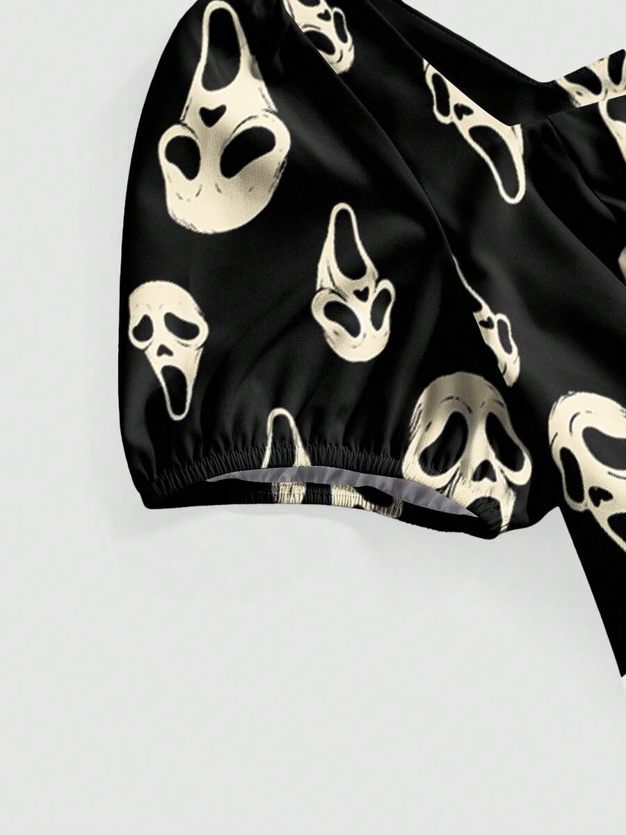Women's black Halloween gothic mini dress featuring short puff sleeves, a square neckline, backless knot detail, and a high-waist A-line flared hem.