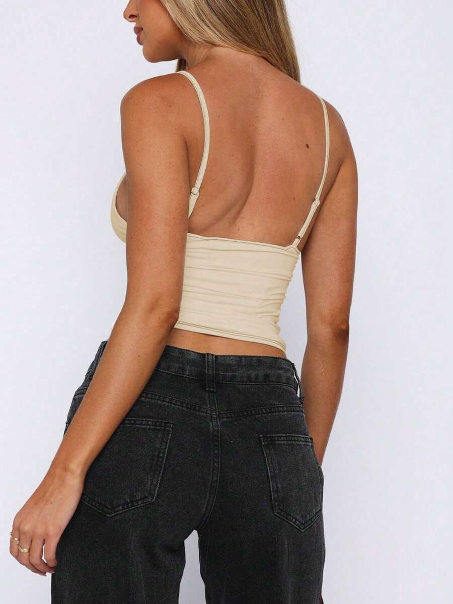 Women's V-neck backless camisole crop top with ruched detailing in a slim fit knit fabric.