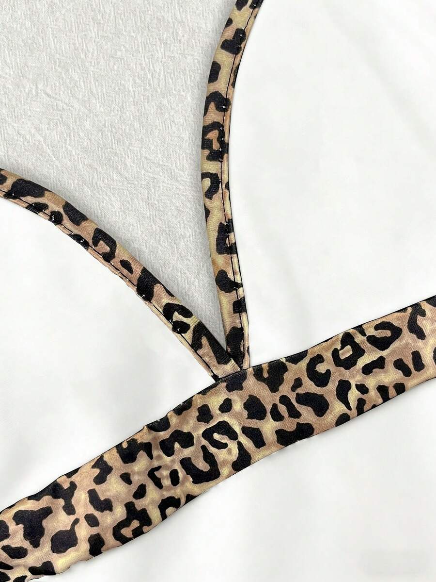 A women's solid slim fit camisole top with delicate contrast lace trim around the neckline and spaghetti straps.
