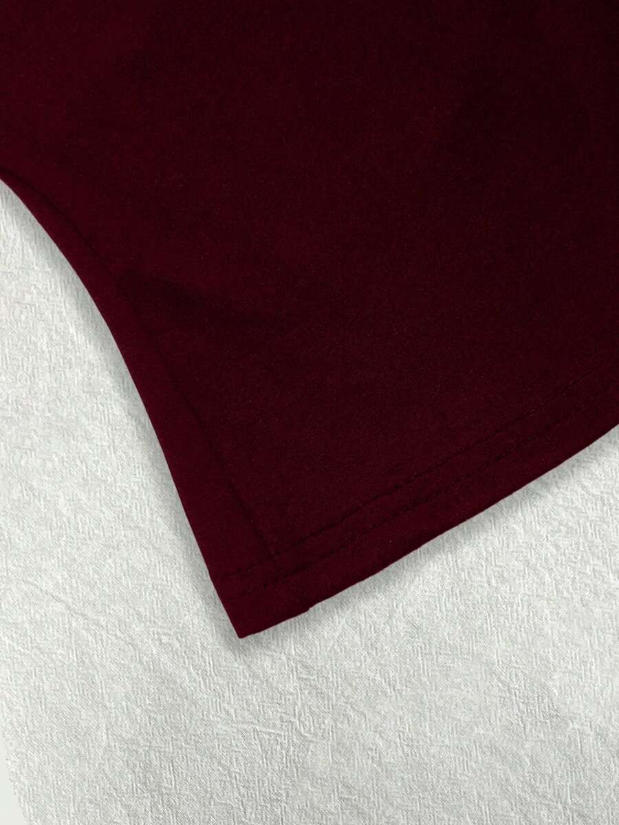 A women's solid slim fit camisole top with delicate contrast lace trim around the neckline and spaghetti straps.