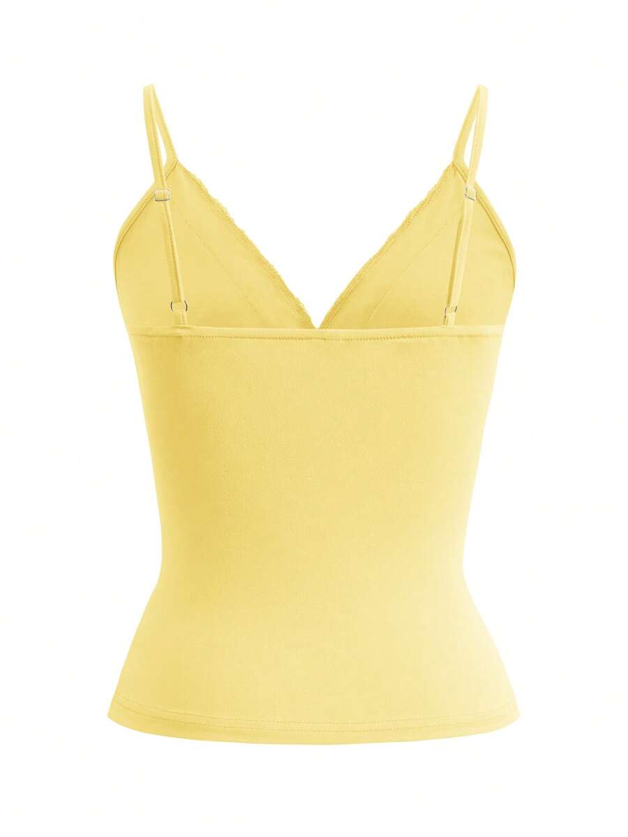 Women's deep V-neck camisole top featuring contrast hollow lace trim, cutout detail, and thin spaghetti straps.