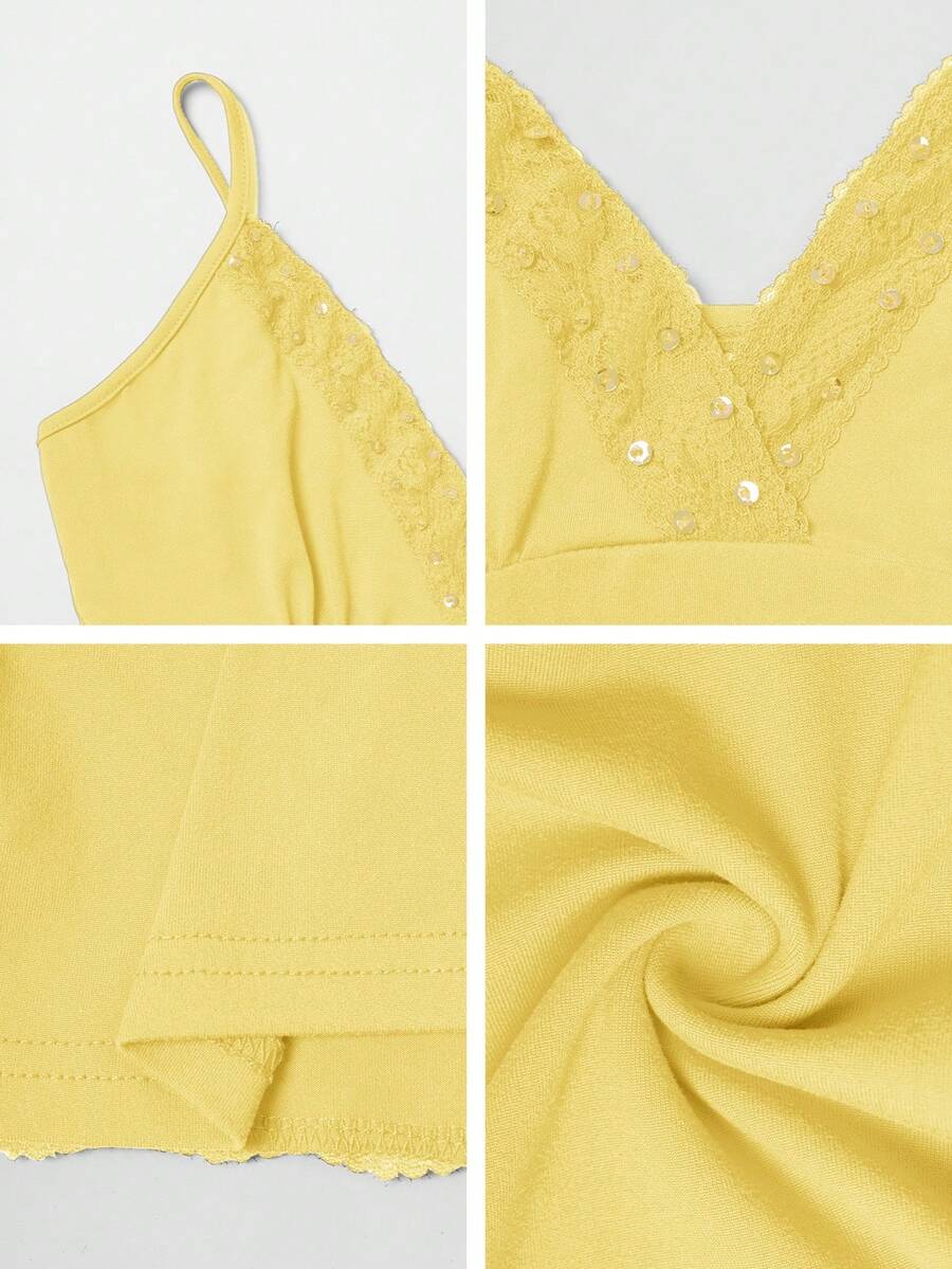 Women's deep V-neck camisole top featuring contrast hollow lace trim, cutout detail, and thin spaghetti straps.