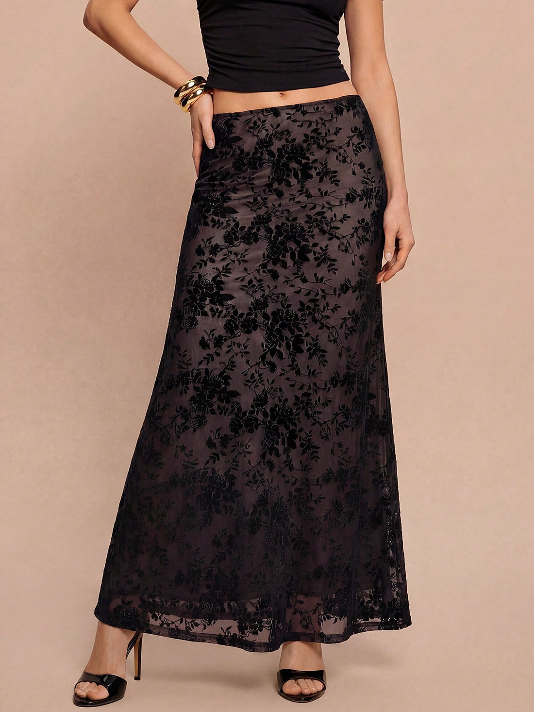 Women's black lace long mermaid skirt featuring lettuce trim, ruffle hem, random print pattern, low waist, and zipper detail.