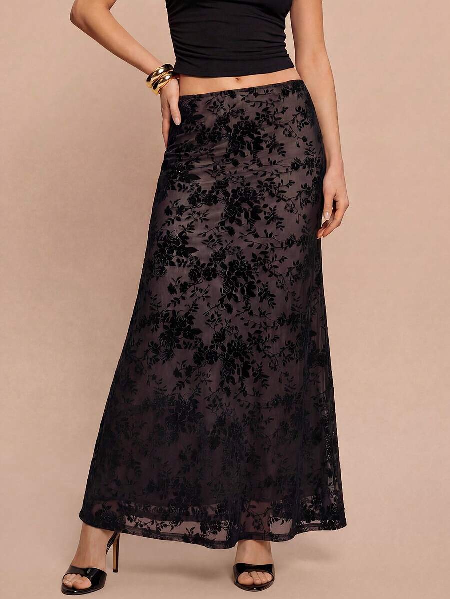 Women's black lace long mermaid skirt featuring lettuce trim, ruffle hem, random print pattern, low waist, and zipper detail.