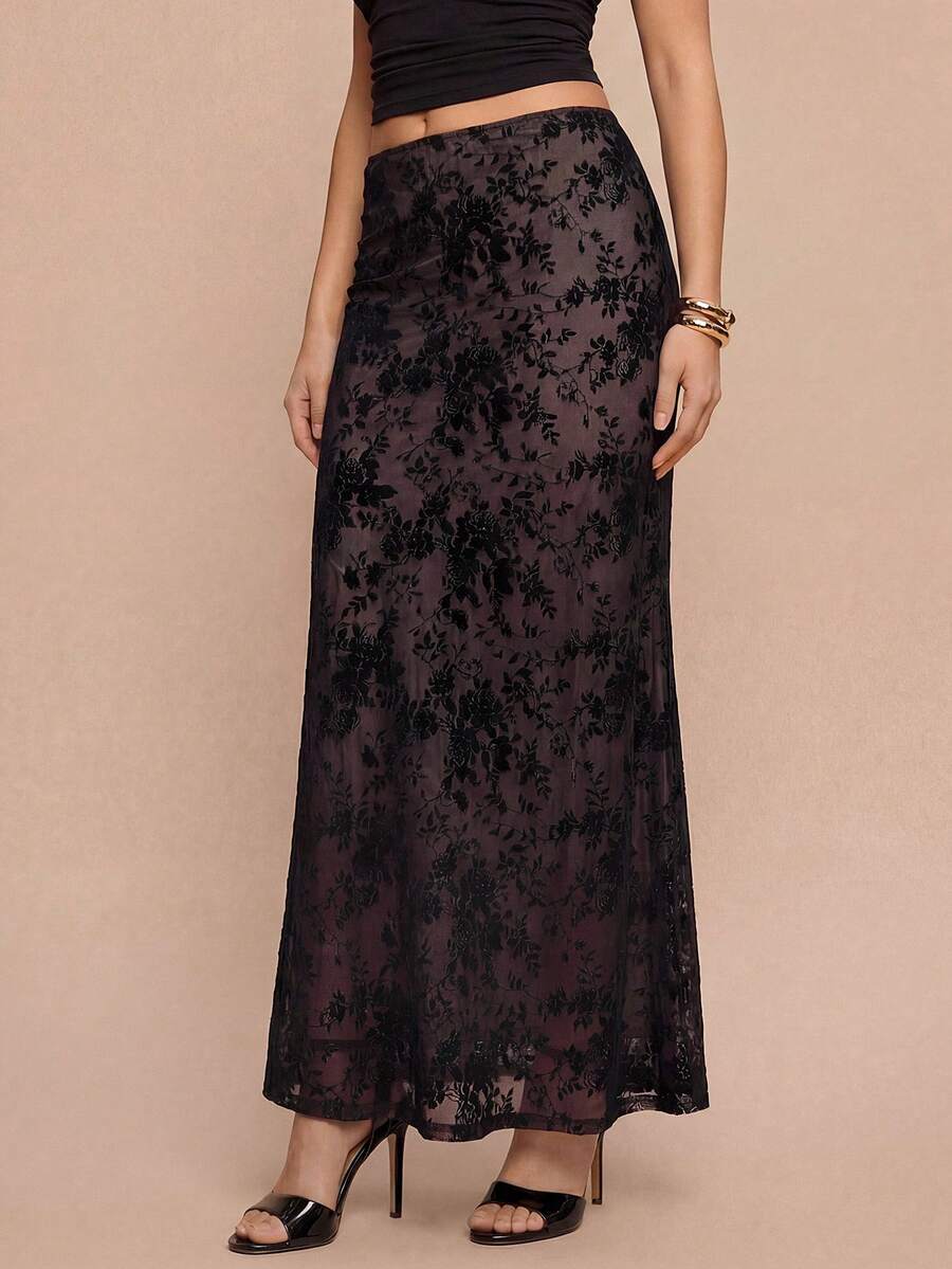 Women's black lace long mermaid skirt featuring lettuce trim, ruffle hem, random print pattern, low waist, and zipper detail.