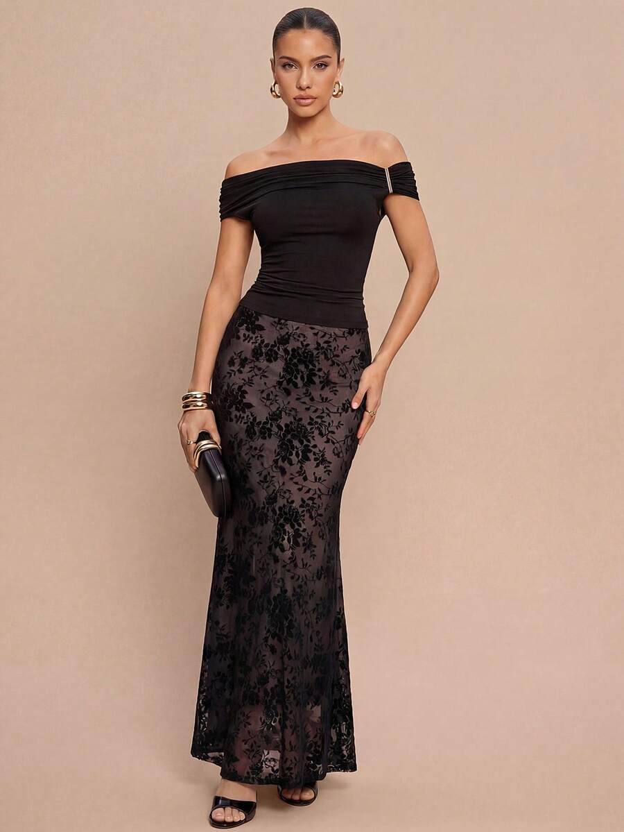 Women's black lace long mermaid skirt featuring lettuce trim, ruffle hem, random print pattern, low waist, and zipper detail.