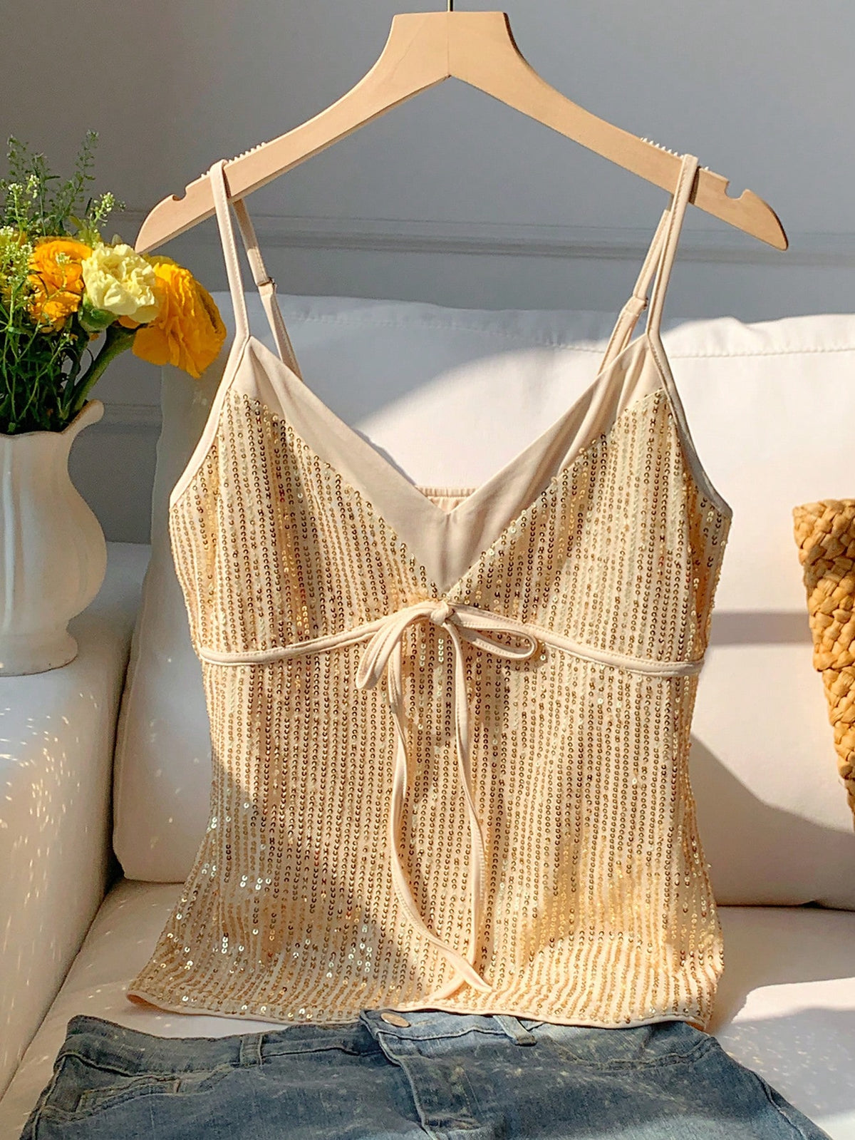 Black and white polka dot tie strap camisole top for women with thin spaghetti straps and slim fit.