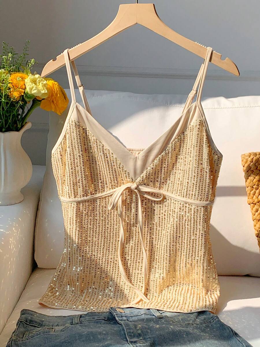 Black and white polka dot tie strap camisole top for women with thin spaghetti straps and slim fit.