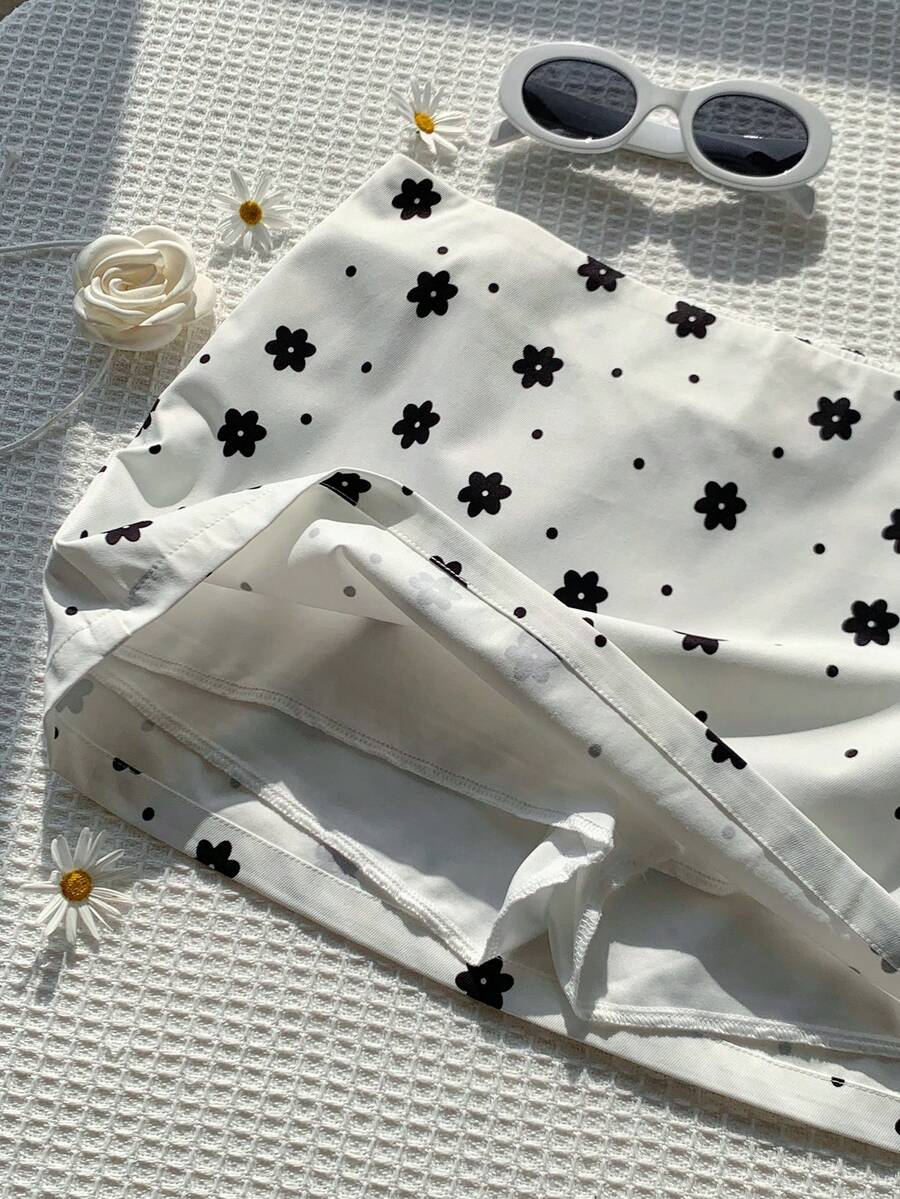 Women's white 100% cotton low waist mini skirt featuring a tropical print and zipper detail.