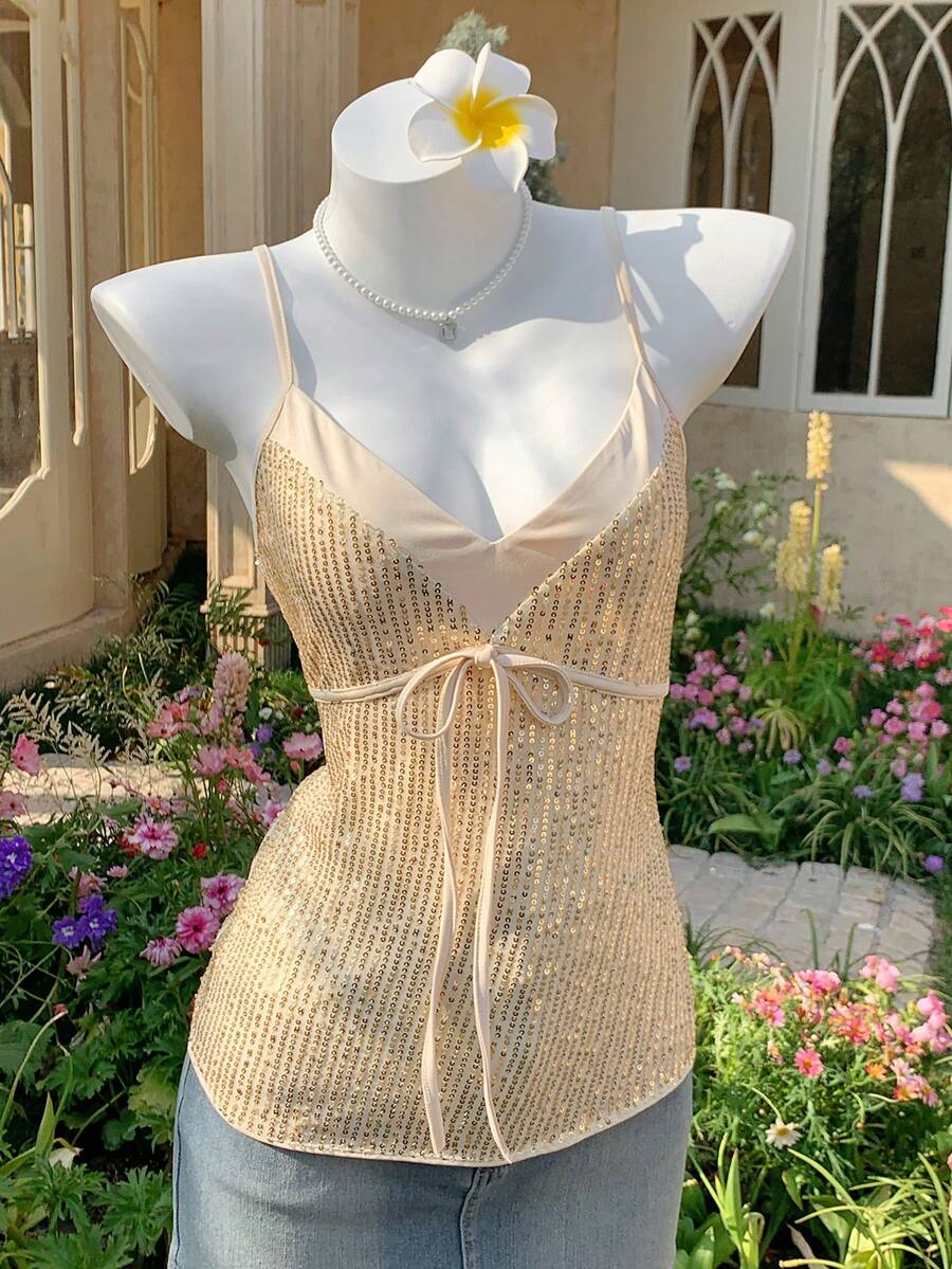 Black and white polka dot tie strap camisole top for women with thin spaghetti straps and slim fit.