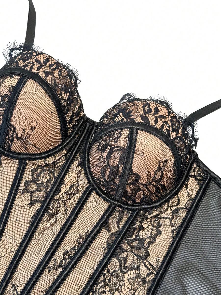 Black women's shaping cami with contrast lace, spaghetti straps, asymmetrical hem, lined body, and slim fit for casual and night-out styling.