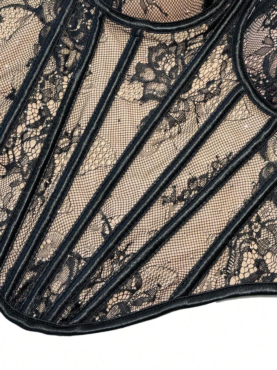 Black women's shaping cami with contrast lace, spaghetti straps, asymmetrical hem, lined body, and slim fit for casual and night-out styling.