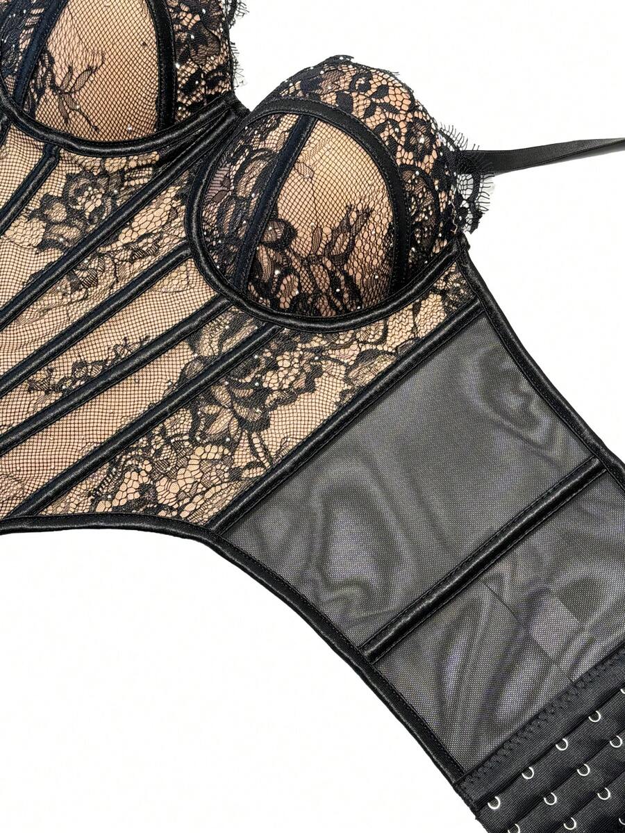 Black women's shaping cami with contrast lace, spaghetti straps, asymmetrical hem, lined body, and slim fit for casual and night-out styling.