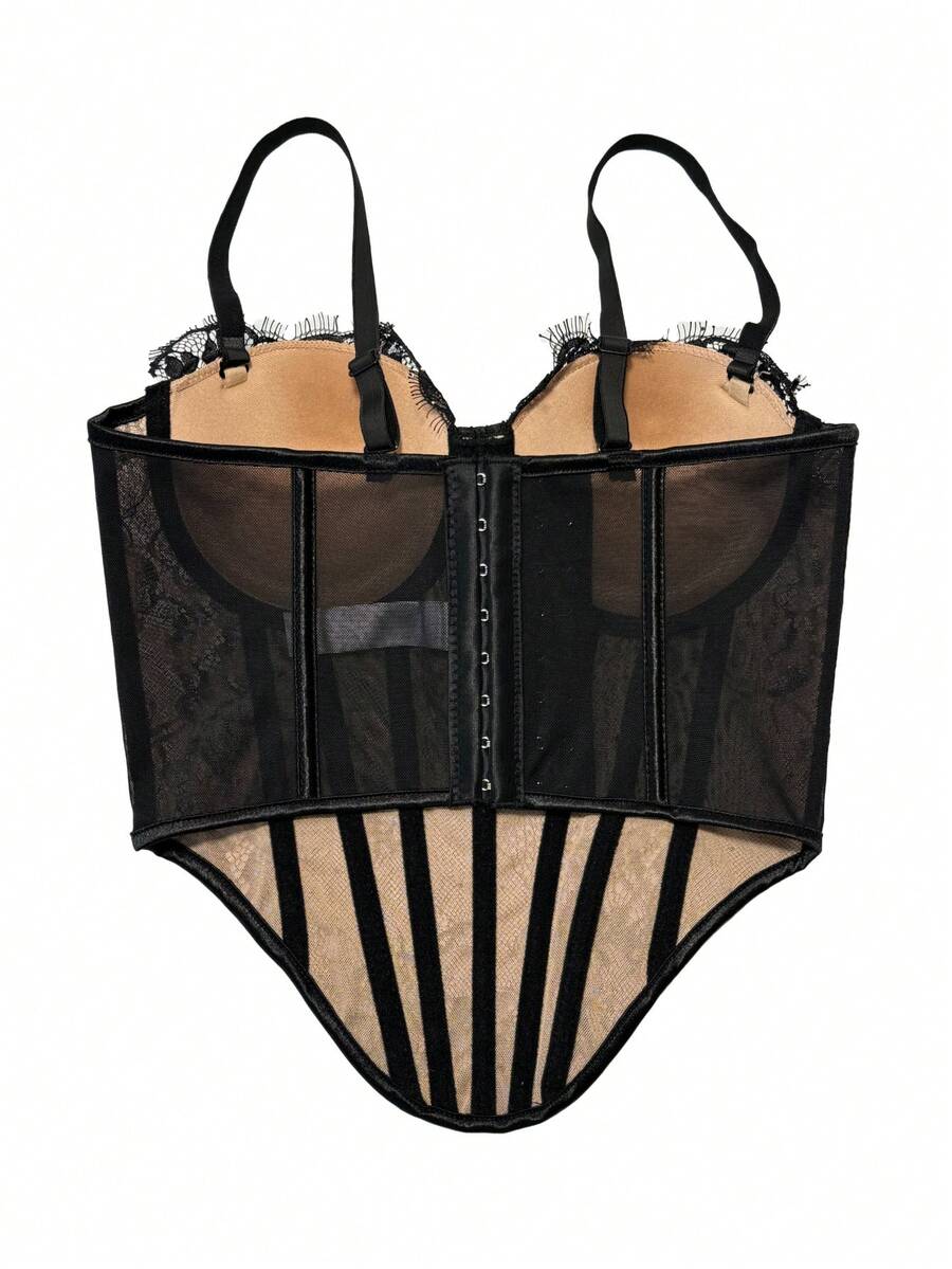 Black women's shaping cami with contrast lace, spaghetti straps, asymmetrical hem, lined body, and slim fit for casual and night-out styling.
