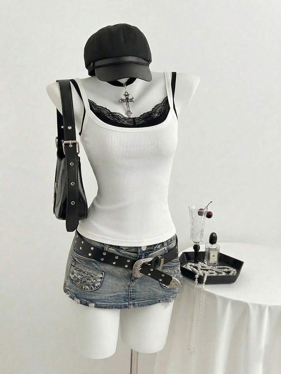 Women's slim fit spaghetti strap cami tank top with contrast lace trim along the neckline