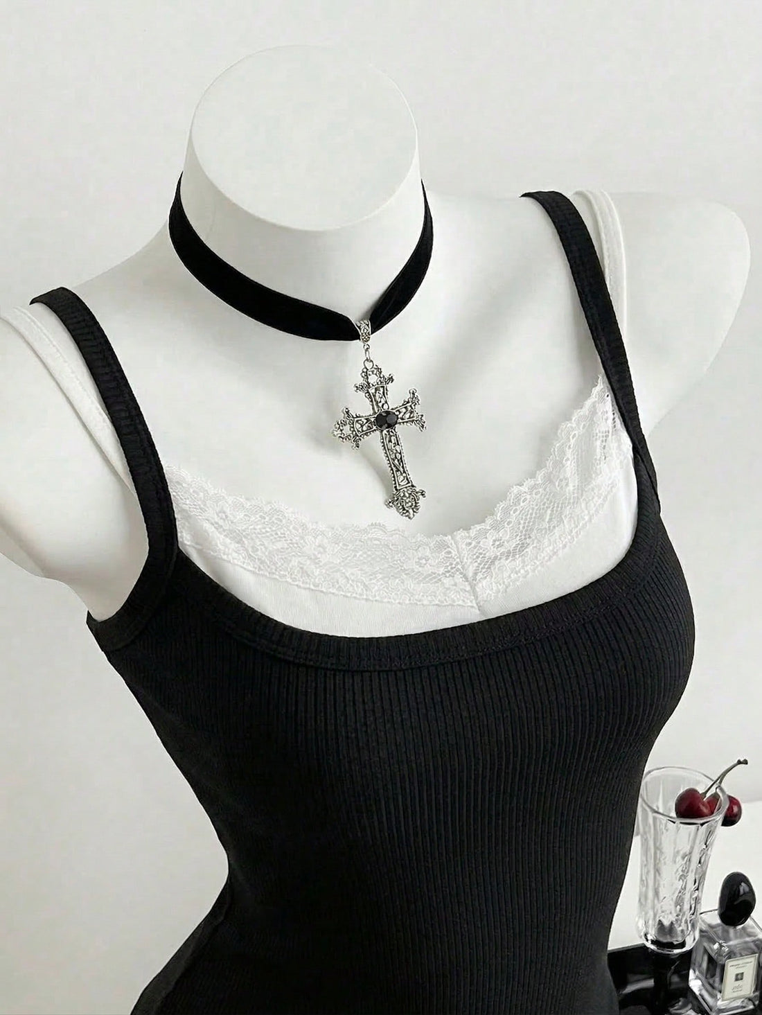 Women's slim fit spaghetti strap cami tank top with contrast lace trim along the neckline