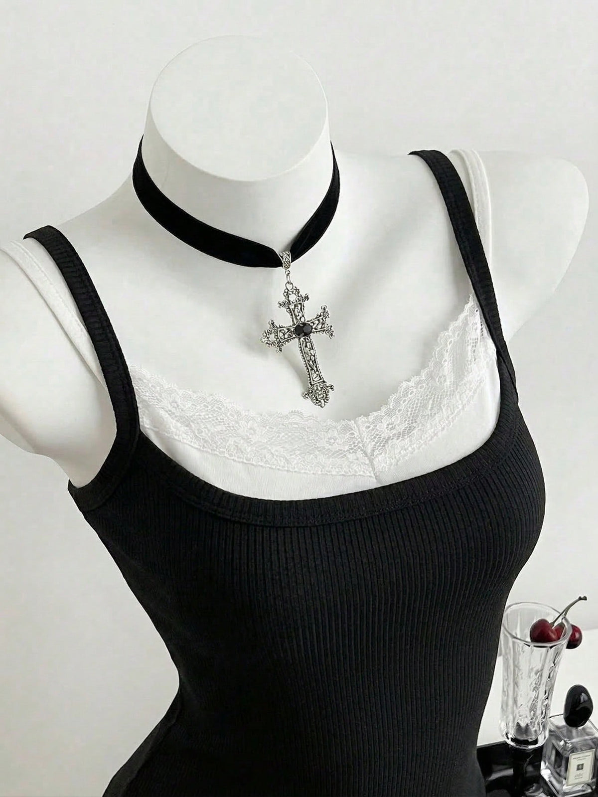 Women's slim fit spaghetti strap cami tank top with contrast lace trim along the neckline