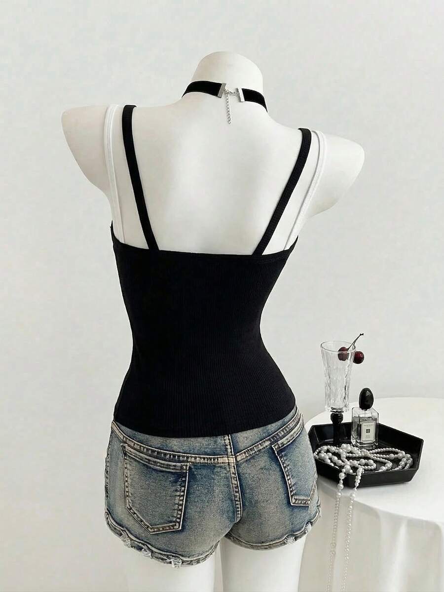 Women's slim fit spaghetti strap cami tank top with contrast lace trim along the neckline