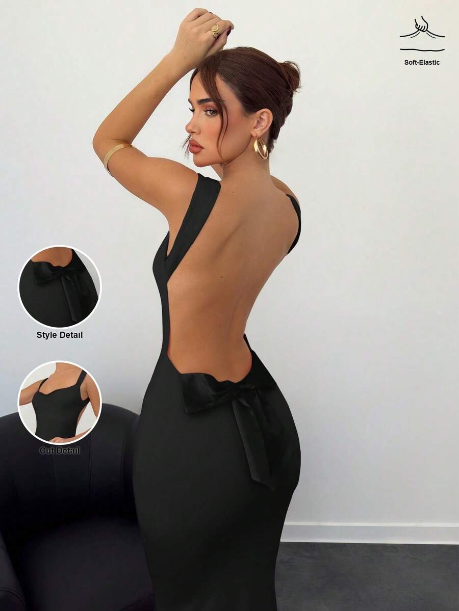 Beige sleeveless backless cami maxi dress for women featuring bow decor, split hem, and slim fit knitted fabric.