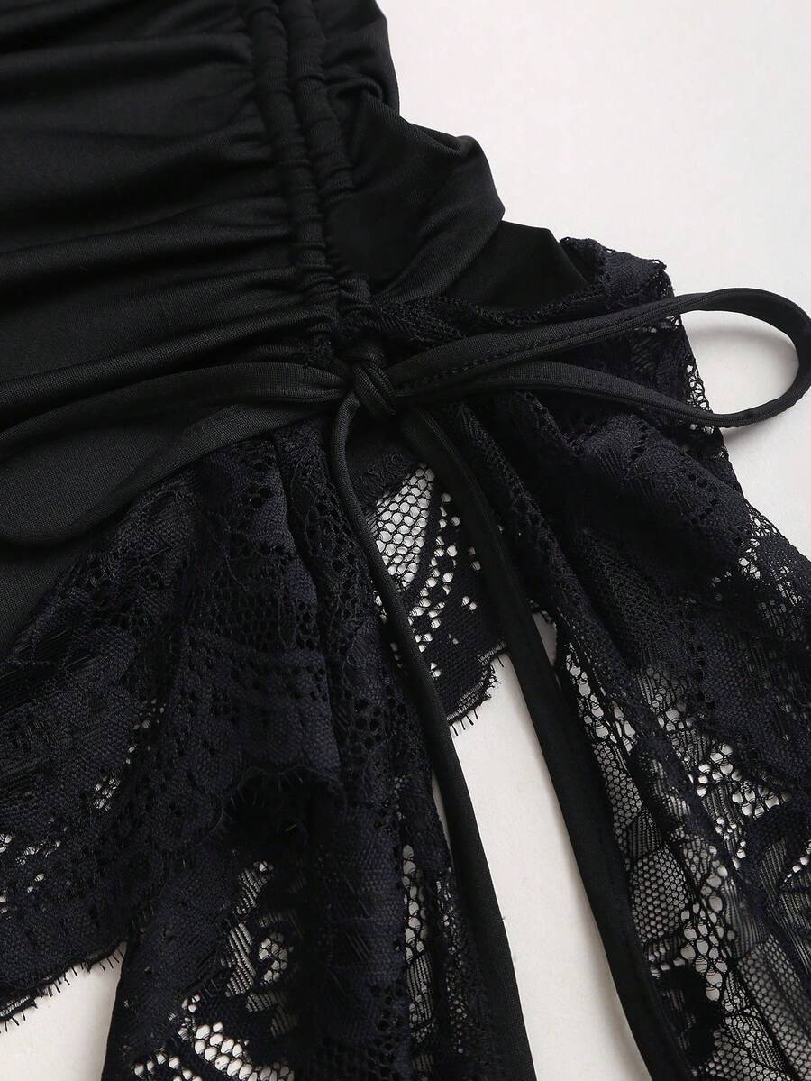 Women's black strapless lace patchwork bodycon mini dress featuring a slim fit design and an asymmetrical hem.