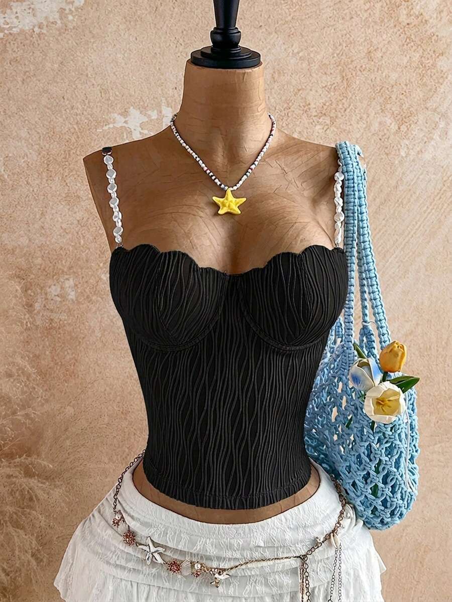 Women's black molded cup camisole top with scallop detailing and spaghetti straps.
