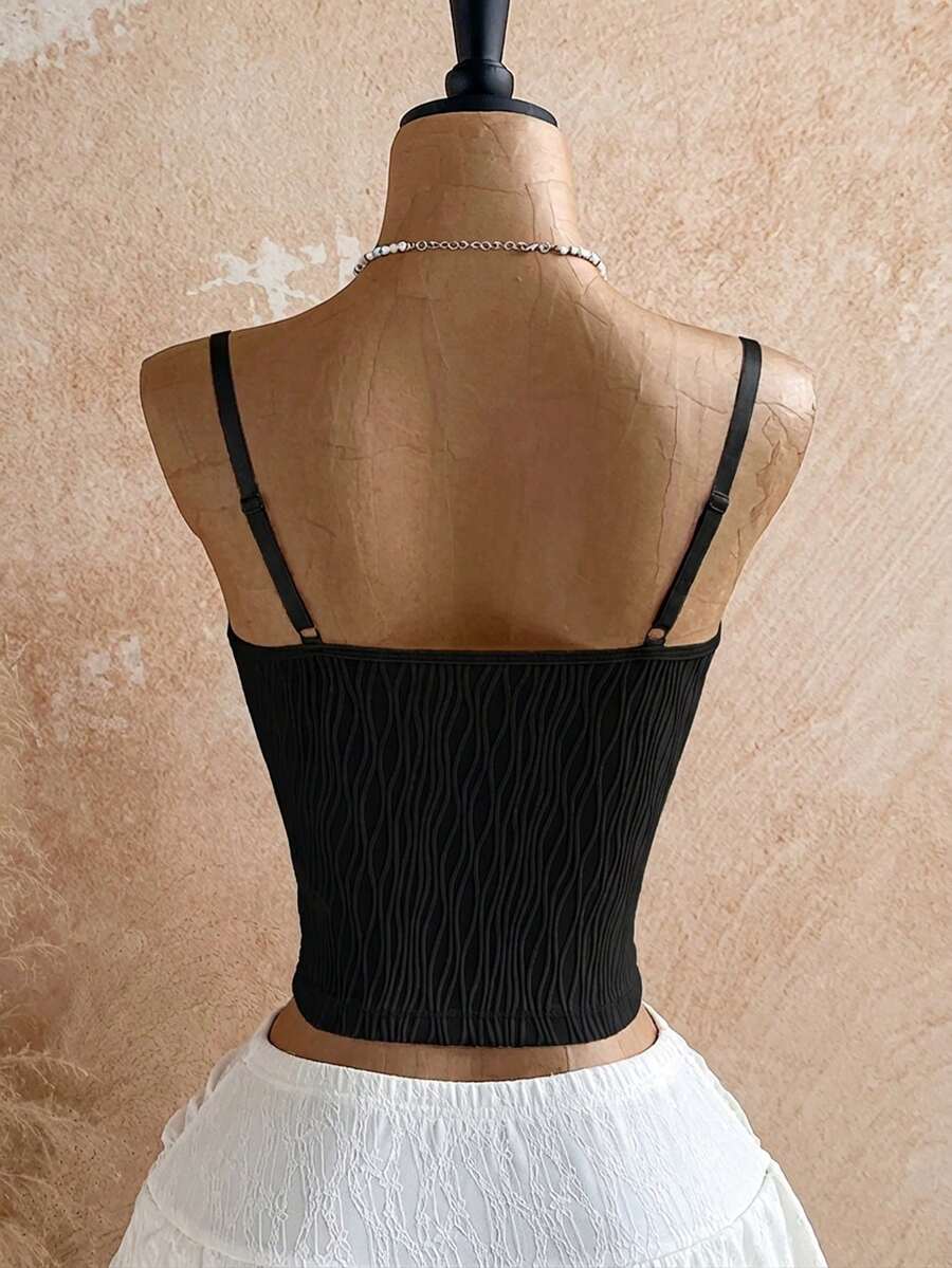Women's black molded cup camisole top with scallop detailing and spaghetti straps.