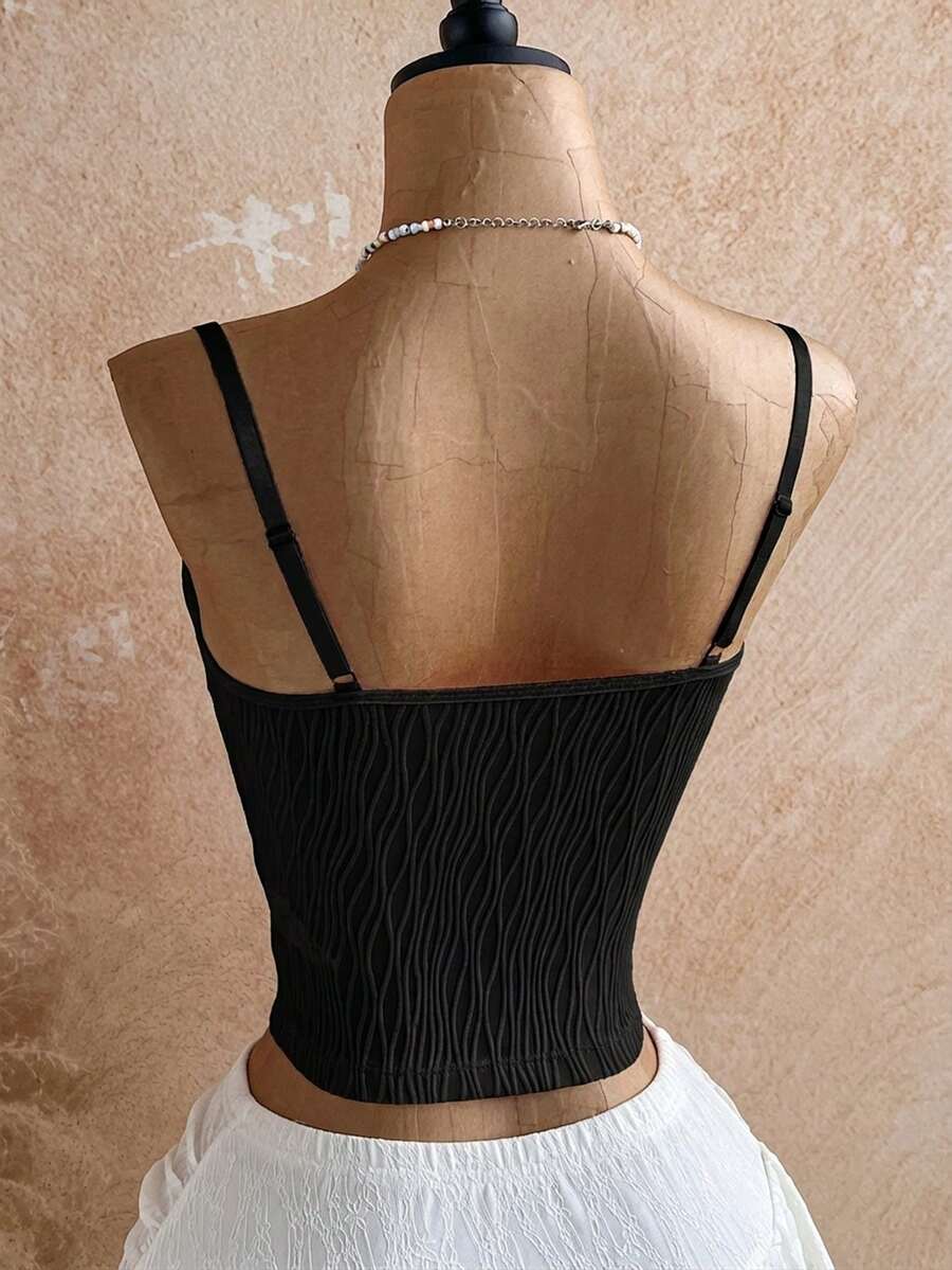 Women's black molded cup camisole top with scallop detailing and spaghetti straps.
