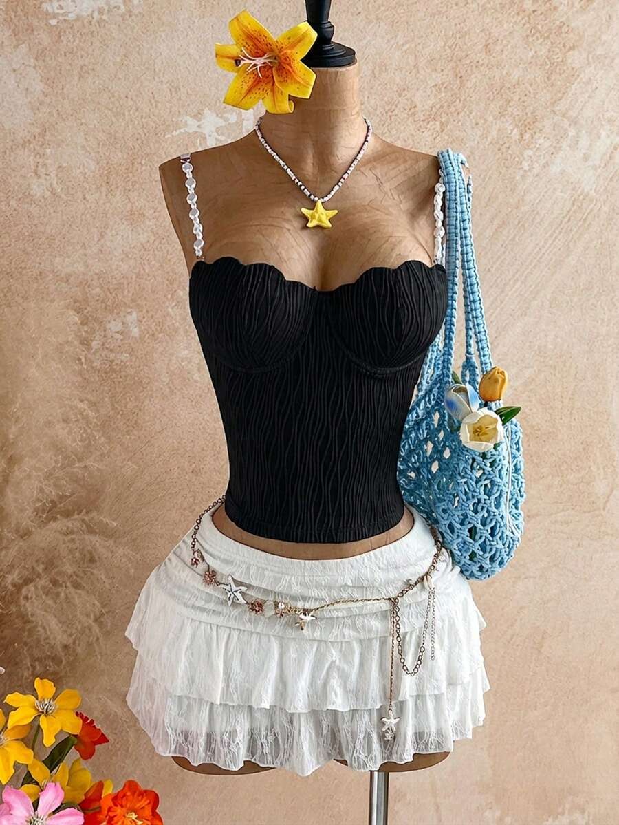 Women's black molded cup camisole top with scallop detailing and spaghetti straps.