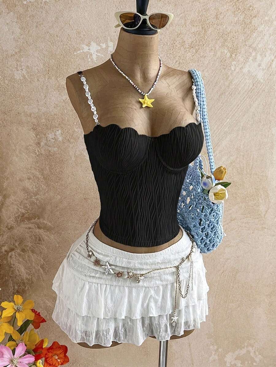 Women's black molded cup camisole top with scallop detailing and spaghetti straps.