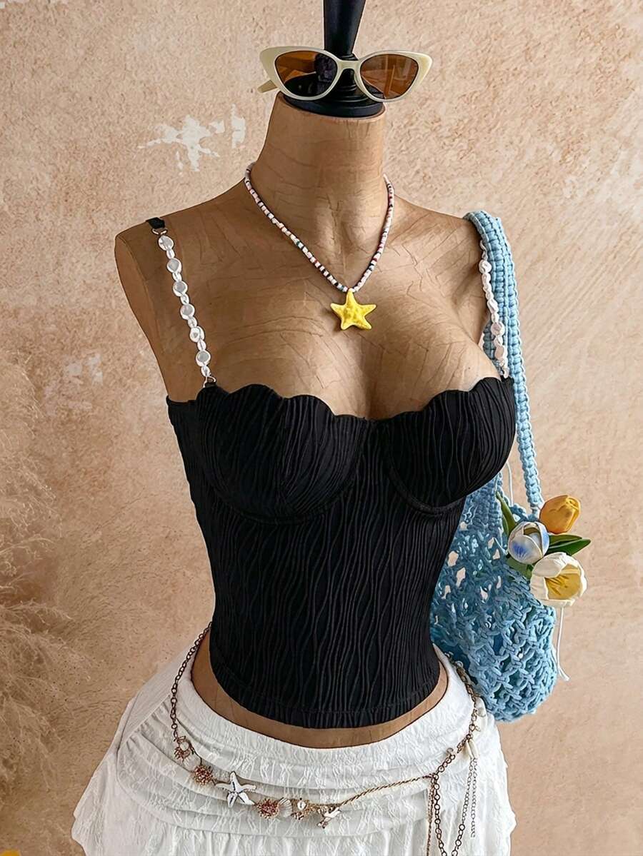 Women's black molded cup camisole top with scallop detailing and spaghetti straps.