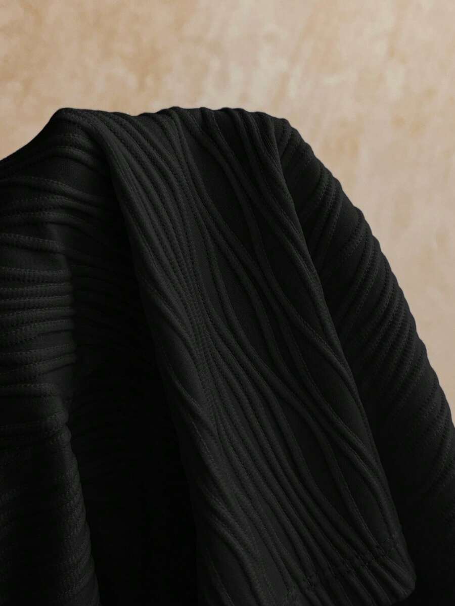Women's black molded cup camisole top with scallop detailing and spaghetti straps.